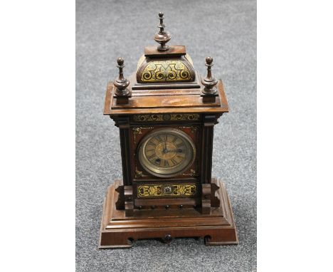 A continental inlaid stained beech wood bracket clock 