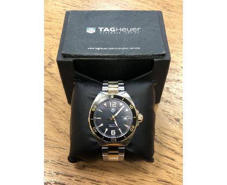 A gent's Tag Heuer stainless steel and yellow gold Formula 1 quartz calendar wristwatch, ref. WAZ1121, case 42mm, black dial 