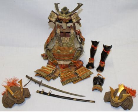 A modern Japanese miniature display of Samurai armour on display stand , 8½" high together with lacquered mempo, miniature ka