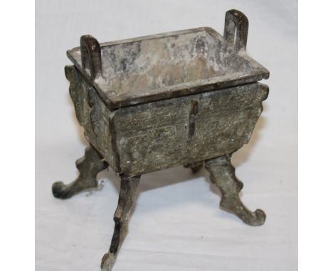 An early Chinese bronze rectangular koro with geometric decoration on four scroll legs 5½" high overall 
