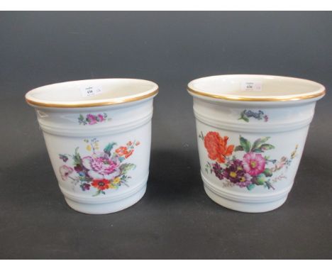 A pair of floral painted ceramic vases  