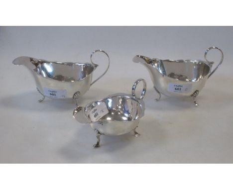 A small pair of silver sauceboats by William Hutton & Sons, Birmingham 1928 and another smaller example (damaged)  