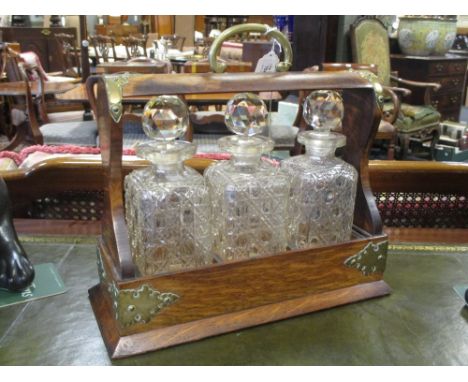 An oak three decanter tantalus  