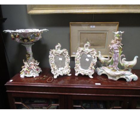 A pair of Sitzendorf style figural table mirrors, a Thuringia moulded centrepiece and one other (some damage) (4)  