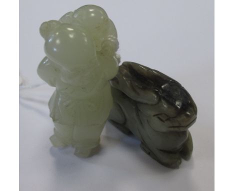 A jade carving of a man carrying a small child on his back, 5cm high, together with a jade carving of a rabbit, 4cm long (2) 