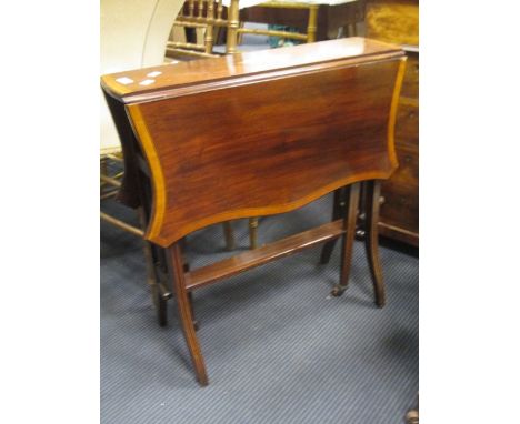 An Edwardian inlaid small mahogany butterfly shape Sutherland table, an Edwardian revolving mahogany desk armchair, a single 