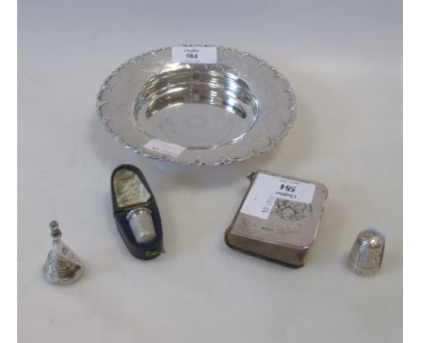 A small Mappin & Webb silver scale bordered dish, 14cm diameter, a silver miniature prayer book cover, a cased thimble, silve