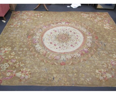 An Aubusson floral carpet on a green ground, 418cm x 325cm  