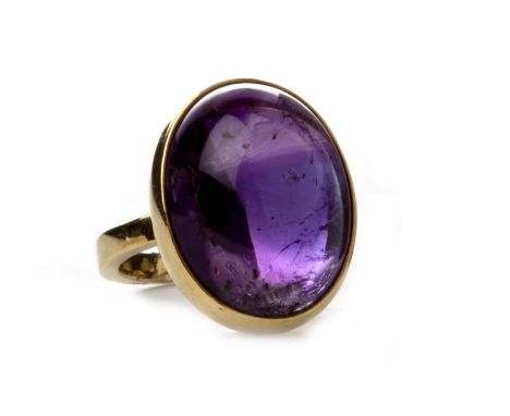 PURPLE GEM SET RING, set with cabochon purple gem 18mm long, marks indistinct, size I 1/2, 11.1g