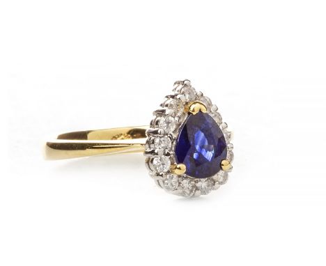 SAPPHIRE AND DIAMOND RING, the pear shaped sapphire 6.6x5.7mm, within a round brilliant cut diamond border, the diamonds tota