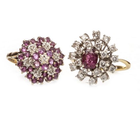 TWO RED GEM AND DIAMOND CLUSTER RINGS, one set with a central oval faceted red gem 6.5mm long within a two rows of round bril