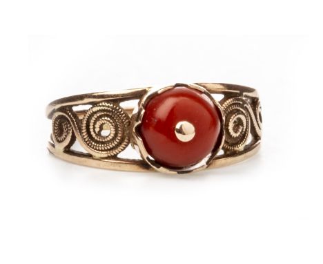 CORAL SET RING, with a round cabochon cut section of coral on openwork shoulders, unmarked, size M 1/2, 2.8g