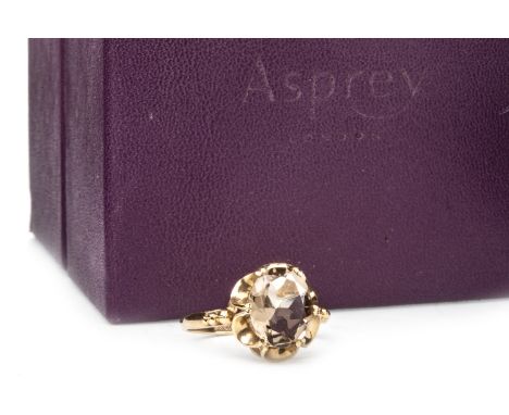 ASPREY GEM SET RING, set with an oval yellow gem within an open scalloped border, in nine carat gold, size M 1/2, 2.3g