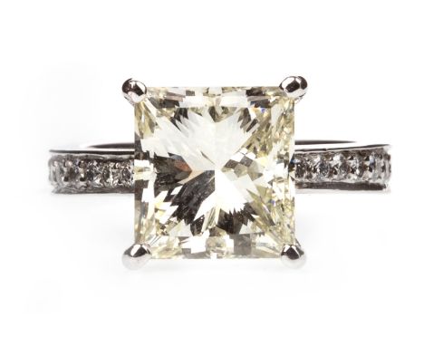 DIAMOND SOLITAIRE RING, the princess cut diamond approximately 4.71 carats, on a diamond set shank, in platinum, size J, 9g