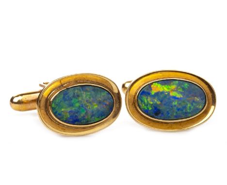 PAIR OF OPAL DOUBLET CUFFLINKS, each set with an oval opal within a gold coloured border, marked Britannic and 9CT to reverse