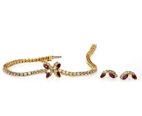 RUBY AND DIAMOND BRACELET, set with round brilliant cut diamonds totalling approximately 3.84 carats, with a central butterfl