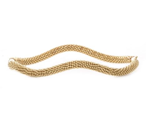 BEADED BANGLE, of waved oval form, 70mm wide, marks worn, 14.6g