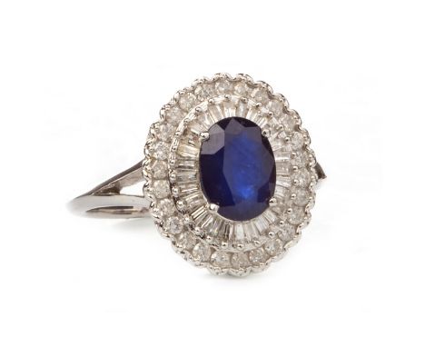 SAPPHIRE AND DIAMOND CLUSTER RING, set with a central oval faceted sapphire 8.1mm long and within a double diamond halo with 