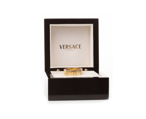 GENTLEMAN'S VERSACE RING, with Greek key motifs to the 8mm wide bezel, marked VERSACE and 750 to the shank, size W, 12.4g, in