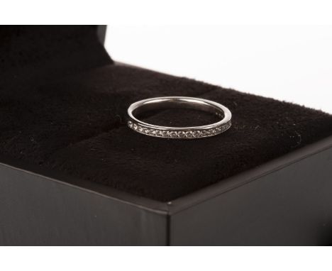 PLATINUM DIAMOND WEDDING BAND, with channel set round brilliant cut diamonds, size K 1/2, 2.7g