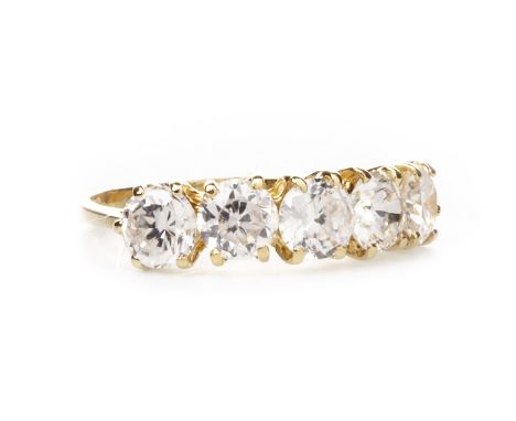 GEM SET FIVE STONE RING, set with round faceted white gems, each approximately 4.9mm diameter, marked 750, size M, 2.8g