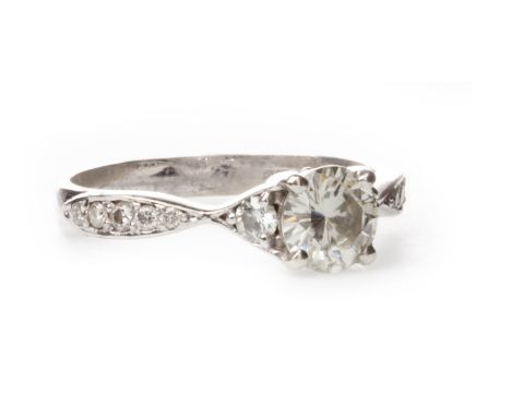 MOISSANITE RING, set with a central round faceted moissanite 6mm diameter on gem set shoulders, marked 375, size N 1/2, 2.5g