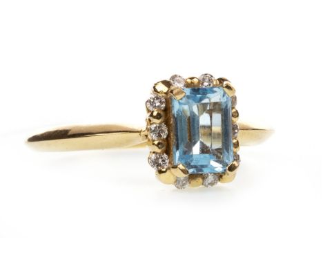 BLUE GEM AND DIAMOND RING, the central step cut blue gem 6.9x5mm and surrounded by round brilliant cut diamonds totalling app