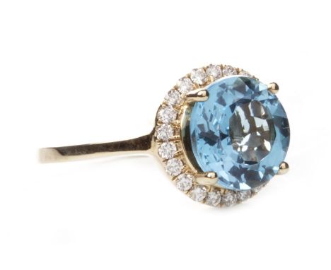 CLOGAU GOLD BLUE TOPAZ AND DIAMOND GOLD RING, set with a central round faceted blue topaz 9.9mm diameter within a diamond hal