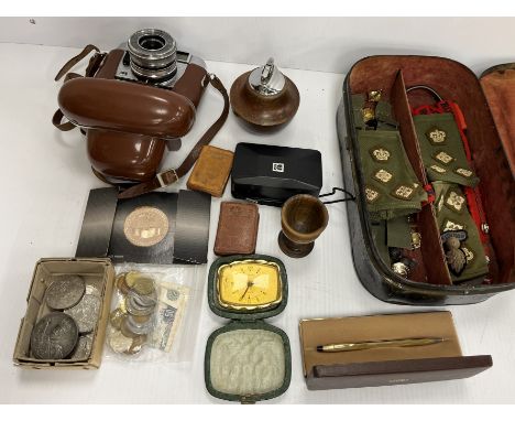 A tin hat box inscribed "Jones & Co. Tailors" containing various cap badges, buttons, rank epaulettes, name tapes, etc. for T
