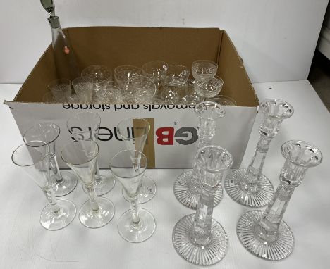 A collection of glassware to include a set of four cut glass candlesticks, a part suite of Edinburgh Crystal cut glass wines 