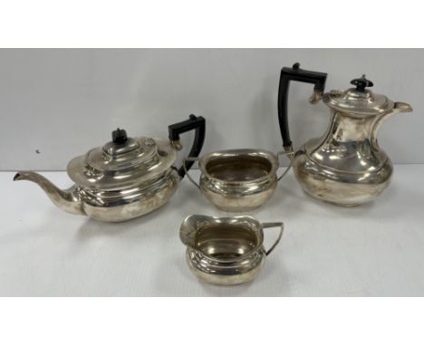 A George VI silver four-piece tea set comprising tea pot, water jug, sugar basin and milk jug (by A.L. Davenport Ltd, Birming