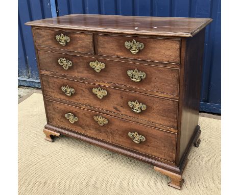 A 19th Century mahogany chest, the plain top with applied moulded edge over two short and three long graduated drawers with b