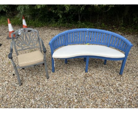 A painted wooden garden bench of curved form with slat back and seat together with an aluminium garden carver chair