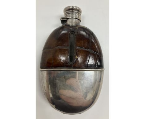 A Victorian silver and leather mounted hip flask (by Sampson Mordan & Co, London 1883), weighable silver 2.3 oz