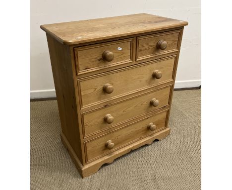 A modern pine chest of two short over three long graduated drawers with turned knob handles, on a bracket foot base, 81 cm wi
