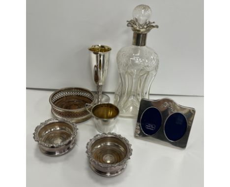 A silver mounted glug glug decanter (by Walker & Hall, Sheffield 1907) together with a small silver beaker with gilded interi