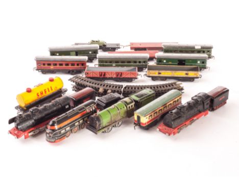 Tinplate’ 00 Gauge items by various makers: including streamlined black locomotive and two plastic-bodied electric-powered 0-