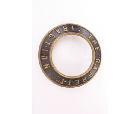 A Garrett Traction Engine Brass Smokebox ring: The “Garrett” Traction’ around the circle in cast brass with black surround, o