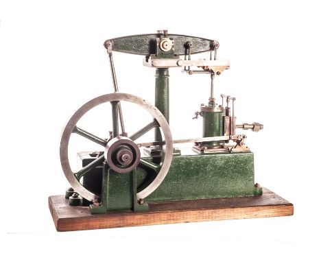 A Stuart Turner Horizontal Beam steam engine: with 7in flywheel, height 11in and length 13in, painted green and fixed on a wo
