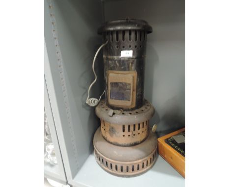 A vintage paraffin sump heater