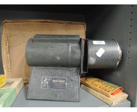 An Ensign Mickey Mouse magic lantern, two sets of slides The three little pigs and The Pied Piper