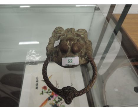 A vintage heavy copper cast lion head door knocker