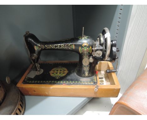 A vintage singer sewing machine with Scottish design rdno. F9204415