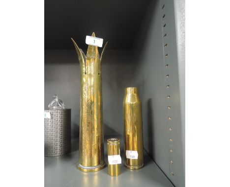 A selection of vintage military ammunition shells and trench art with Egyptian decoration