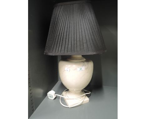 A vintage table top lamp with ceramic base