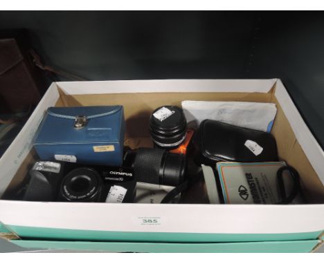 A box of photographic equipment including an Olympus Superzoom 70 camera lenses, film editer etc 