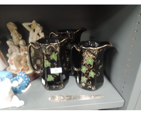A set of vintage graduated jugs