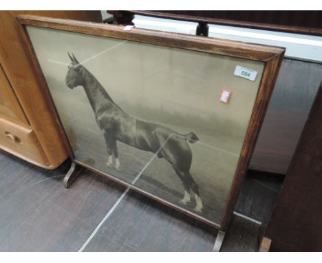 A early 20th Century oak fire screen having equine interest 'supreme champion albion? wildfire (New York)' 