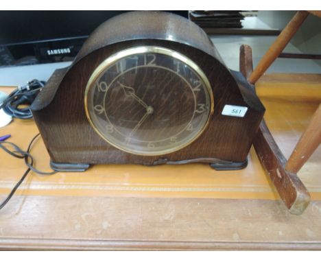 An early to mid 20th Century oak cased mantel clock