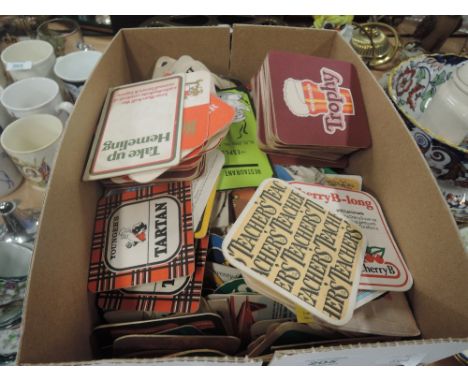 A selection of vintage advertising beer matts